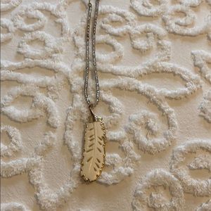 Crystal stone necklace with feather